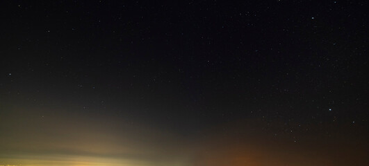 Beautiful winter dark starry sky. Night photography, astronomical background.