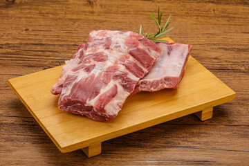 Raw pork ribs served rosemary