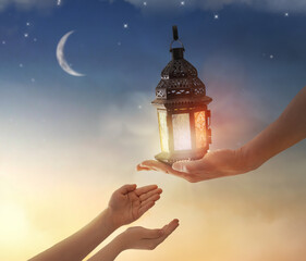 Ornamental Arabic lantern with burning candle