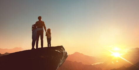 Happy family at sunset.