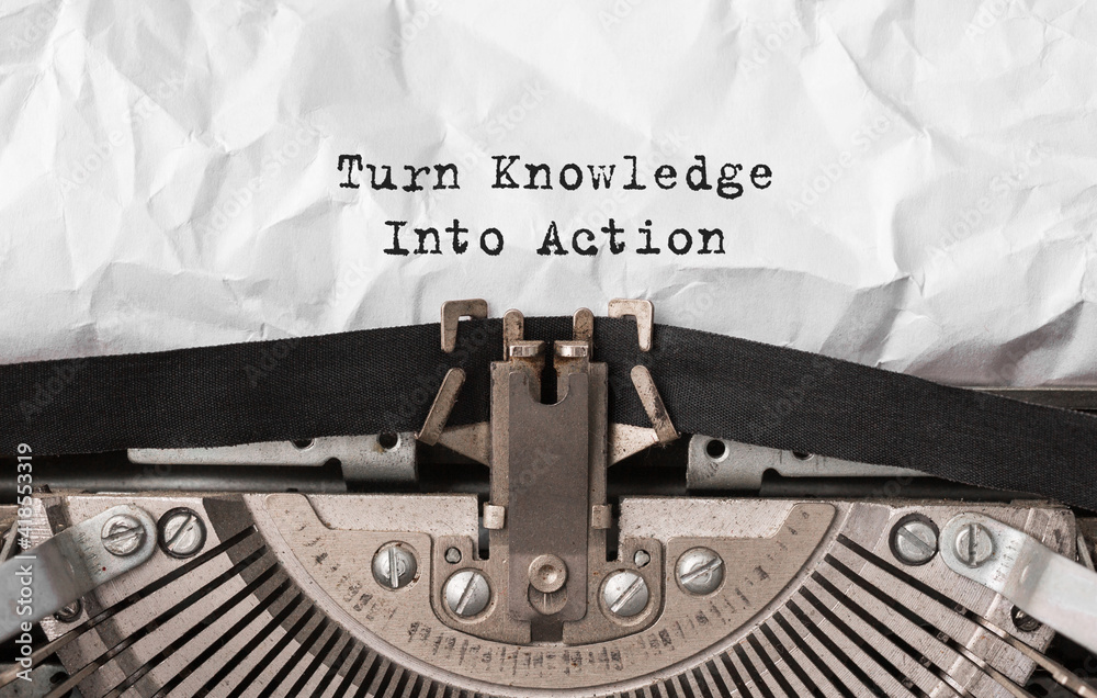 Aufkleber text turn knowledge into action typed on retro typewriter