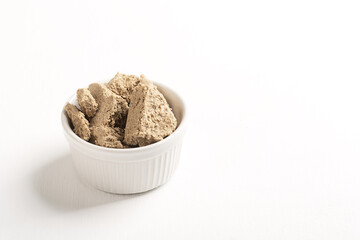 Vegetable-based halva sweet prepared from seeds on white