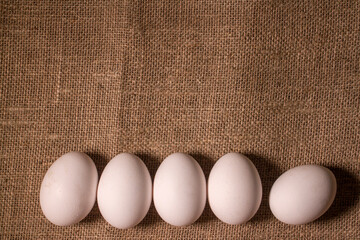 nest with eggs on a sackcloth. Happy Easter eggs. Background with easter eggs.