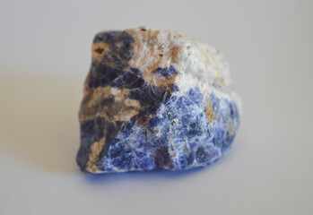 Sodalite mineral stone on a white background