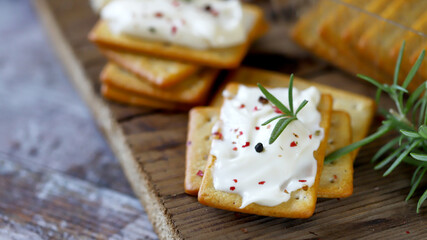 Fototapeta na wymiar Delicious crackers with cream cheese. Cookies with cream cheese.