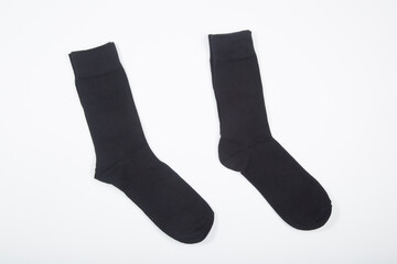 Black men's socks made of cotton on a white background.