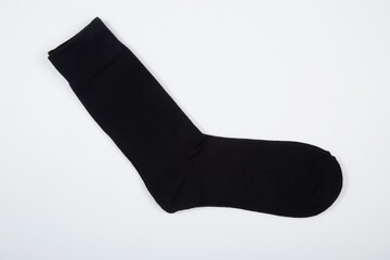 Black men's socks made of cotton on a white background.