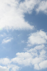 Spring bright blue sky with clouds. Abstract background, copy space