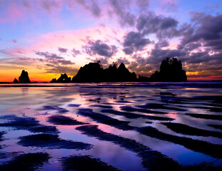 Rocky Coast and Colorful Sunset Reflected in the Tide.  
Olympic National Park, Washington, USA.