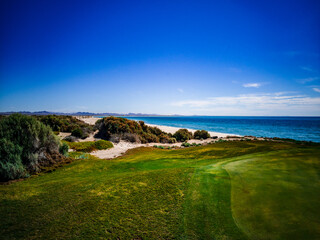 Hole on the Peninsula Golf Course near the Mayan Hotel in Puerto Penasco, Sonora, Mexico on a beautiful winter day with the Sea of Cortez in the background