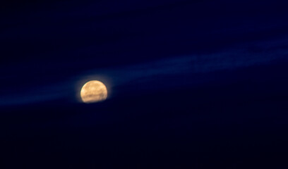 Moonset over the Sea of Cortez one early morning from Rocky Point, Puerto Penasco, Sonora, Mexico looking up towards Sandy Beach through clouds