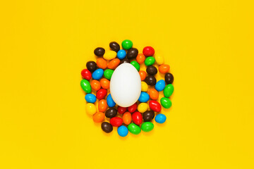 easter eggs chocolate candy on yellow background