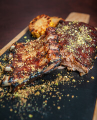 Spicy hot grilled caramelised pork ribs with corn