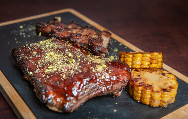 Spicy hot grilled caramelised pork ribs with corn