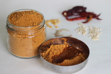 Idli podi or milagai podi is a dry vegan condiment served with idlis or dosa. Basically idli milagai podi is a dry powder made with lentils and red chilies.