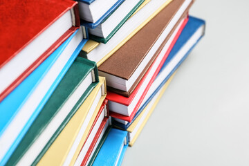 Stack of books on light background