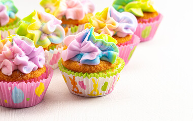 Pastel Rainbow Frosted Easter Cupcakes  on a Kitchen Counter