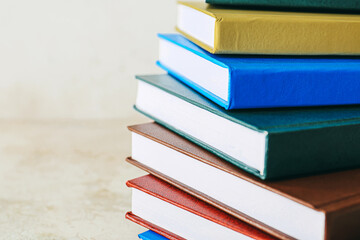 Stack of books on light background, closeup