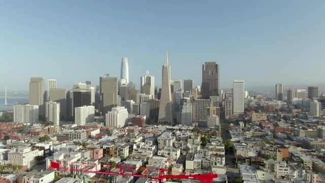 Aerial panning above Telegraph Hill and downtown on a bright sunny day - San Francisco, California