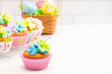Pastel Rainbow Frosted Easter Cupcakes  on a Kitchen Counter