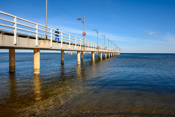 Fototapeta premium Pier in Mechelinki. Mechelinki is a fishing village and a popular tourist destination on the Baltic Sea in Poland