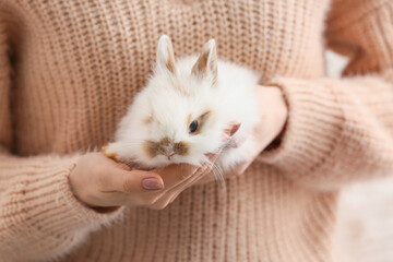 Young woman with cute rabbit, closeup