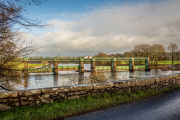 Fototapeta premium Glenlochar Barrage on the River Dee at Loch Ken, Galloway Hydro Electric Scheme