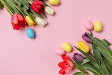 spring tulips and Easter eggs in pastel colors on a delicate pink background. The concept of celebrating Easter, greeting card, invitation to the holiday.