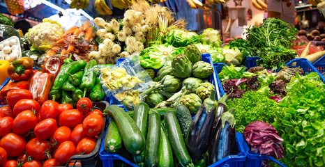 La Boqueria market with vegetables and fruits in Barcelona. Spain. La Boqueria market, Europe's largest and most famous food markets, Barcelona, Spain