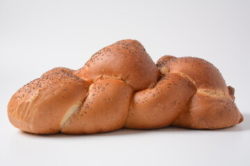 Homemade challah bread with sesame seeds. Jewish traditional bread for Shabbat