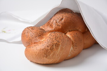 Homemade challah bread with sesame seeds. Jewish traditional bread for Shabbat