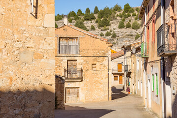 a street with traditional architecture in Castillejo de Robledo, province of Soria, Castile and Leon, Spain