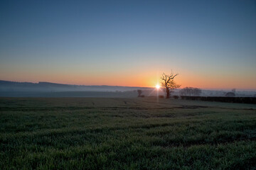 Fototapeta na wymiar Sunrise on a winters morning in a rural part of Suffolk, UK