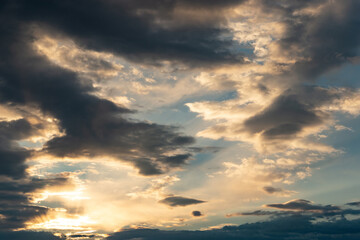 Sunset sky with dramatic clouds. Natural background.