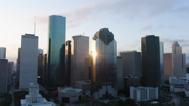 Aerial View Of Downtown Houston At Sunrise Orbiting Right Featuring Wells Fargo PLaza & Heritage Plaza