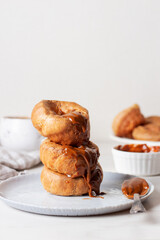 Yorkshire Puddings with condensed milk cream, lying on top of each other.