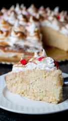 Three milk cake, tres leches cake with cherry and chocolate.