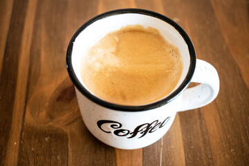 cup of coffee on wooden table