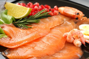 Red fish. Seafood dish, salted salmon shrimp on a flat