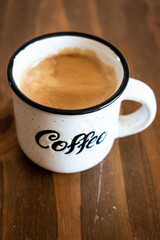 cup of coffee on wooden table