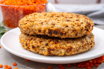 Healthy vegetarian or vegan food, meat free burger made from orange lentils legumes