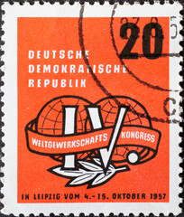 GERMANY, DDR - CIRCA 1957 : a postage stamp from Germany, GDR showing the emblem of the 4th World...