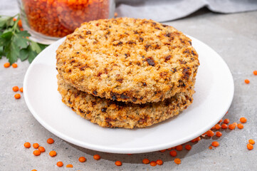 Healthy vegetarian or vegan food, meat free burger made from orange lentils legumes