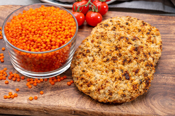 Healthy vegetarian or vegan food, meat free burger made from orange lentils legumes