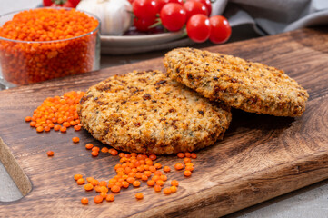 Healthy vegetarian or vegan food, meat free burger made from orange lentils legumes