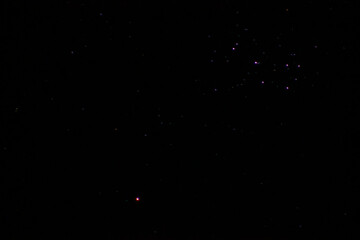 Starry sky. Constellation of the galaxy with a red planet.