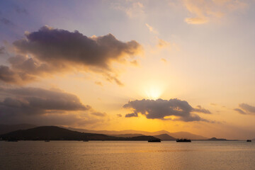 Fototapeta premium Sunset over the bay with fishing boats