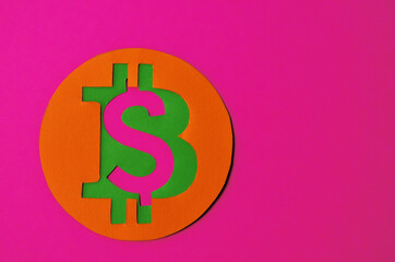 Bitcoin is connected to the dollar on a pink background with a copy space. Conceptual collage about cryptocurrency in the power of minimalism. High quality photo