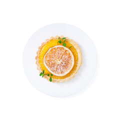 Traditional french lemon tart, top viewTraditional french lemon tart, with orange slice