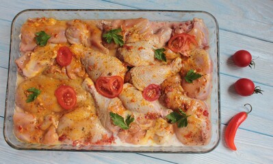 Raw meat, potatoes, tomatoes and spices, top view.	